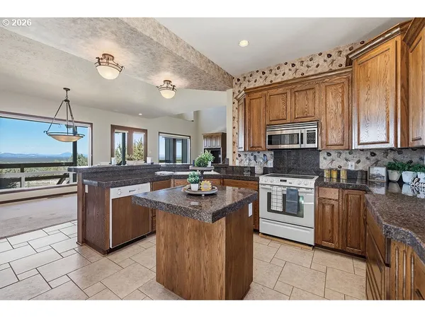 a kitchen with cabinets and appliances