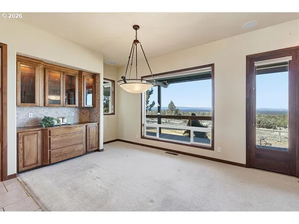 a view of a kitchen with a sink cabinet and a living room