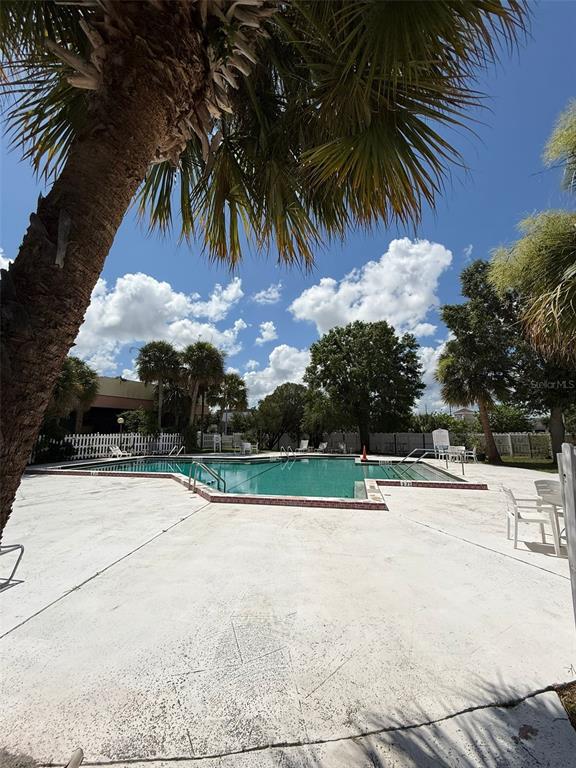 7900 South Orange Blossom Trail, Unit 2084 Orlando, FL 32809 - Photo 13 of 16 a view of swimming pool with a yard