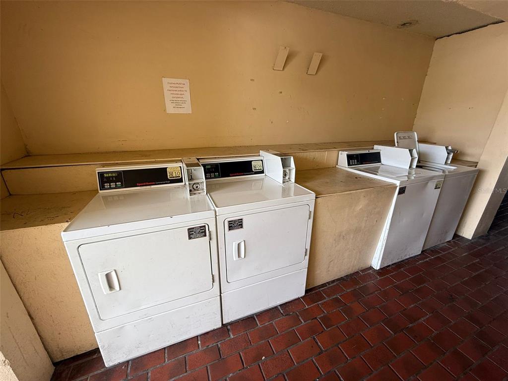 7900 South Orange Blossom Trail, Unit 2084 Orlando, FL 32809 - Photo 15 of 16 a utility room with dryer and washer