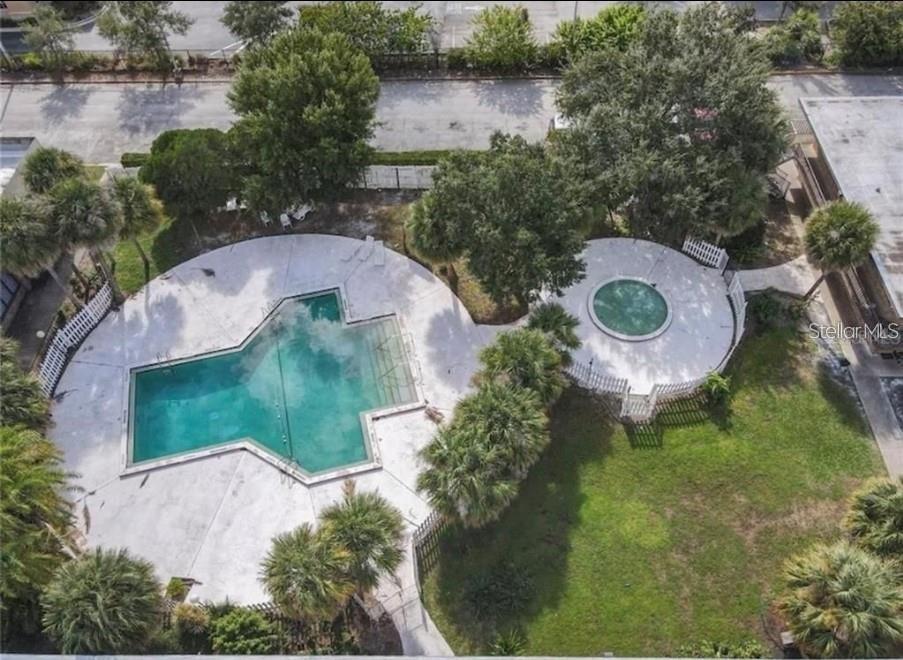 7900 South Orange Blossom Trail, Unit 2084 Orlando, FL 32809 - Photo 8 of 16 an aerial view of a swimming pool and outdoor space