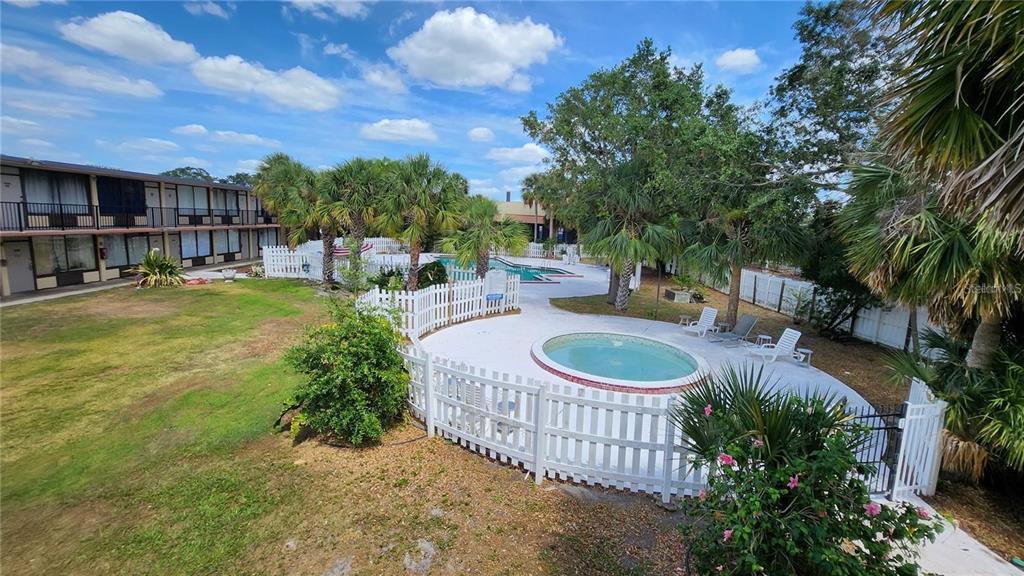 7900 South Orange Blossom Trail, Unit 2084 Orlando, FL 32809 - Photo 9 of 16 a view of a chairs and table in the patio