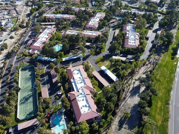 an aerial view of residential houses with outdoor space