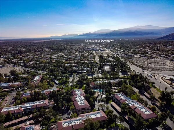 a view of a house with a yard and street view