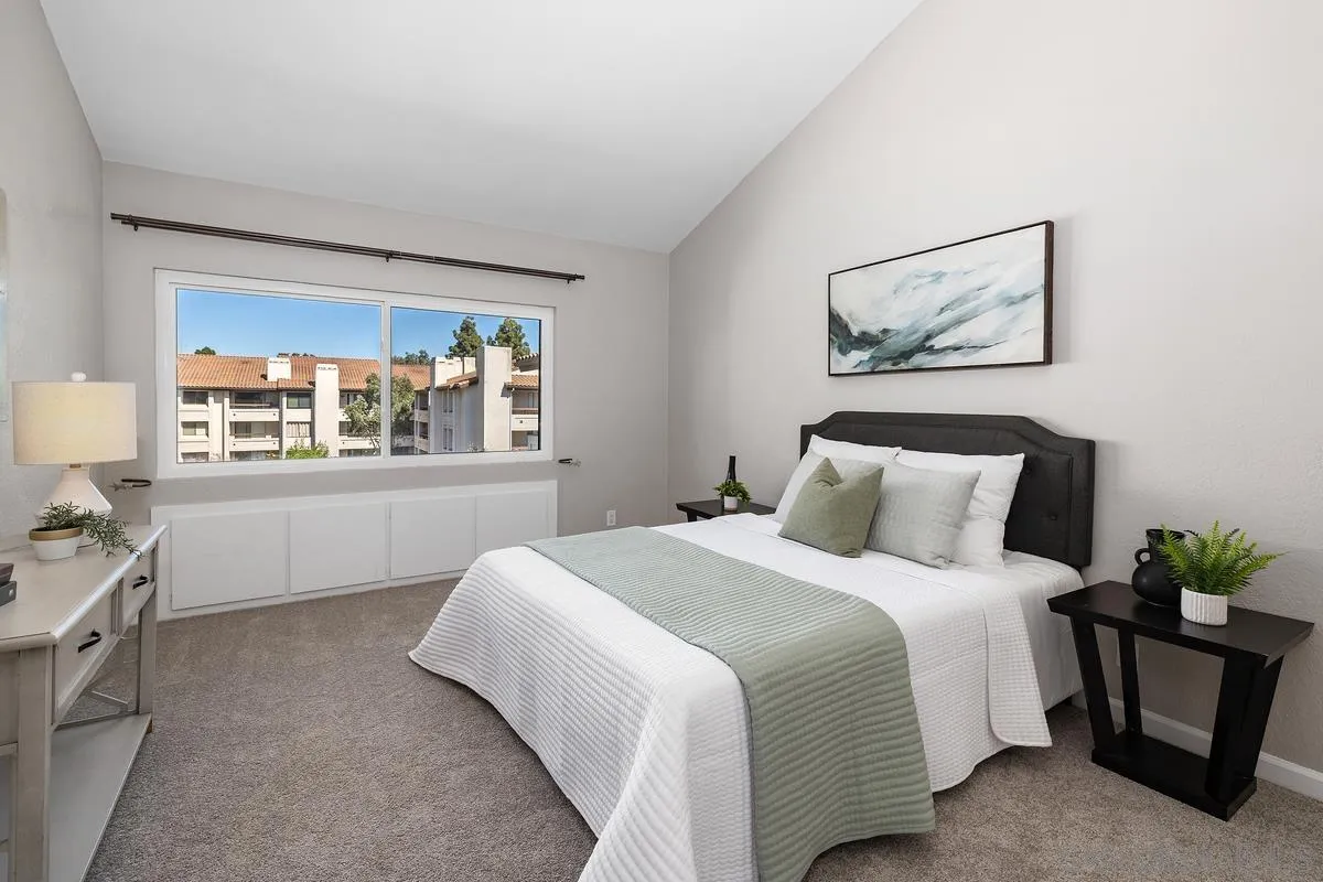 5705 Friars Road, Unit 60 San Diego, CA 92110 - Photo 13 of 49 a bedroom with a bed and a window