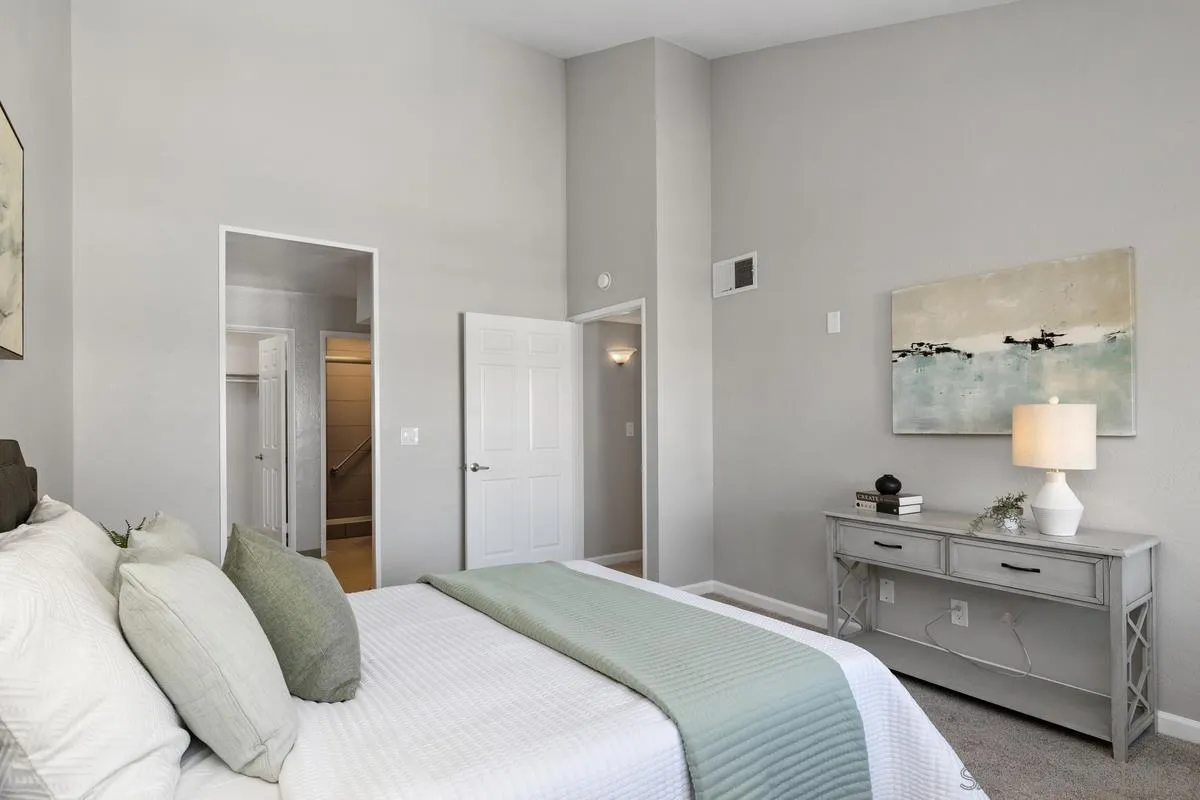 5705 Friars Road, Unit 60 San Diego, CA 92110 - Photo 16 of 49 a bedroom with a bed and a lamp