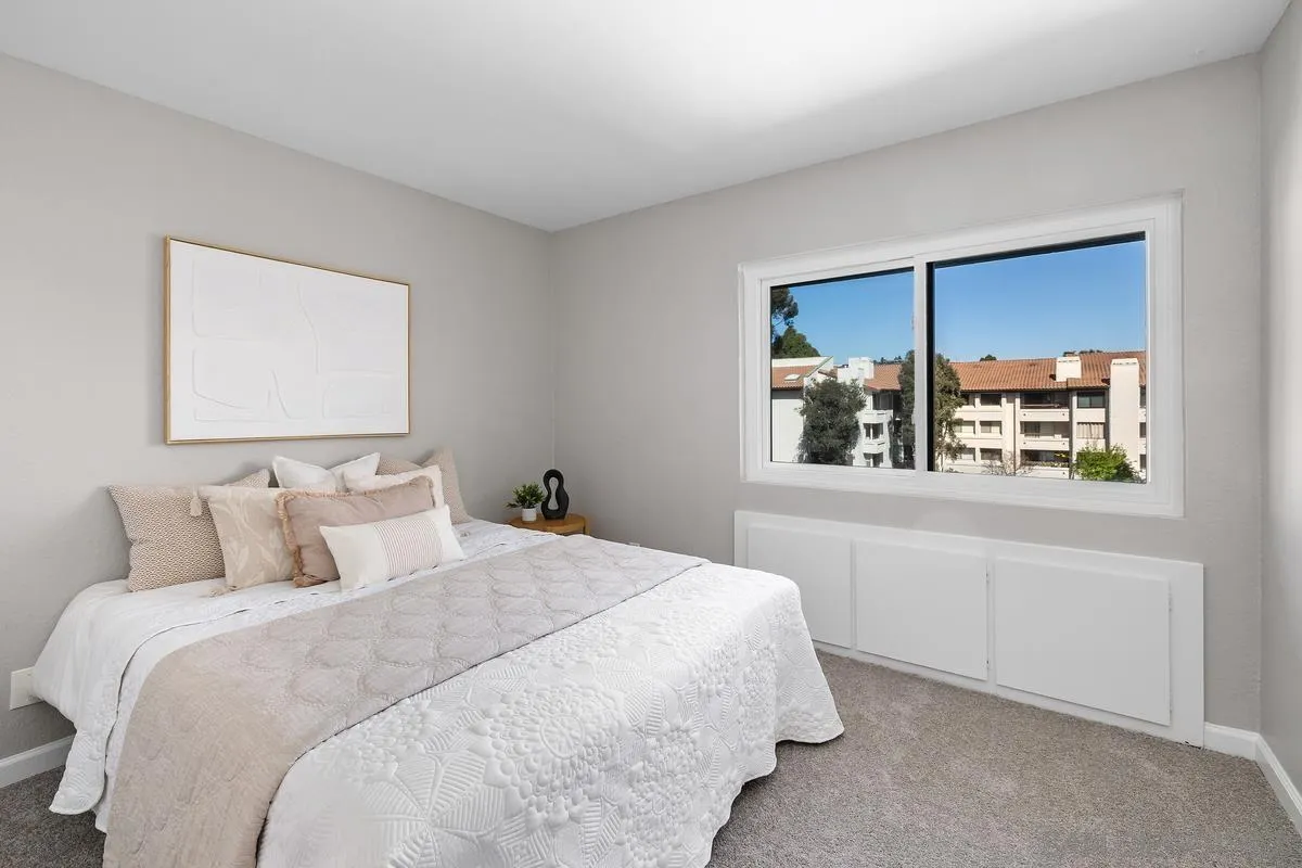 5705 Friars Road, Unit 60 San Diego, CA 92110 - Photo 20 of 49 a bedroom with a bed and a window