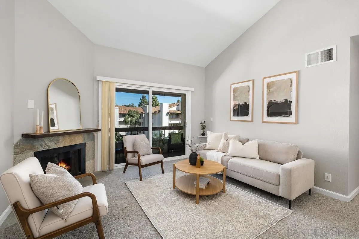 5705 Friars Road, Unit 60 San Diego, CA 92110 - Photo 2 of 49 a living room with furniture and a fireplace