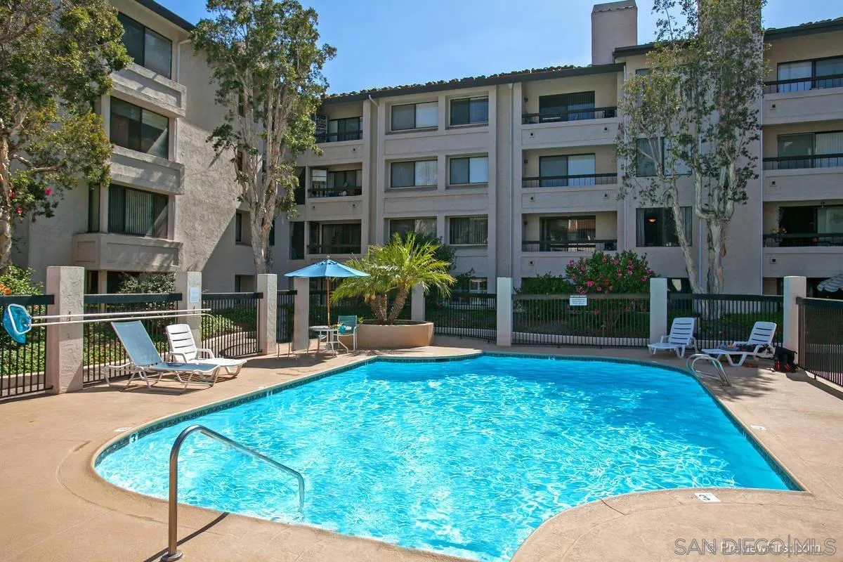 5705 Friars Road, Unit 60 San Diego, CA 92110 - Photo 28 of 49 a view of a house with swimming pool and sitting area
