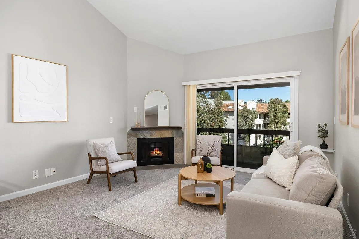 5705 Friars Road, Unit 60 San Diego, CA 92110 - Photo 3 of 49 a living room with furniture and a fireplace