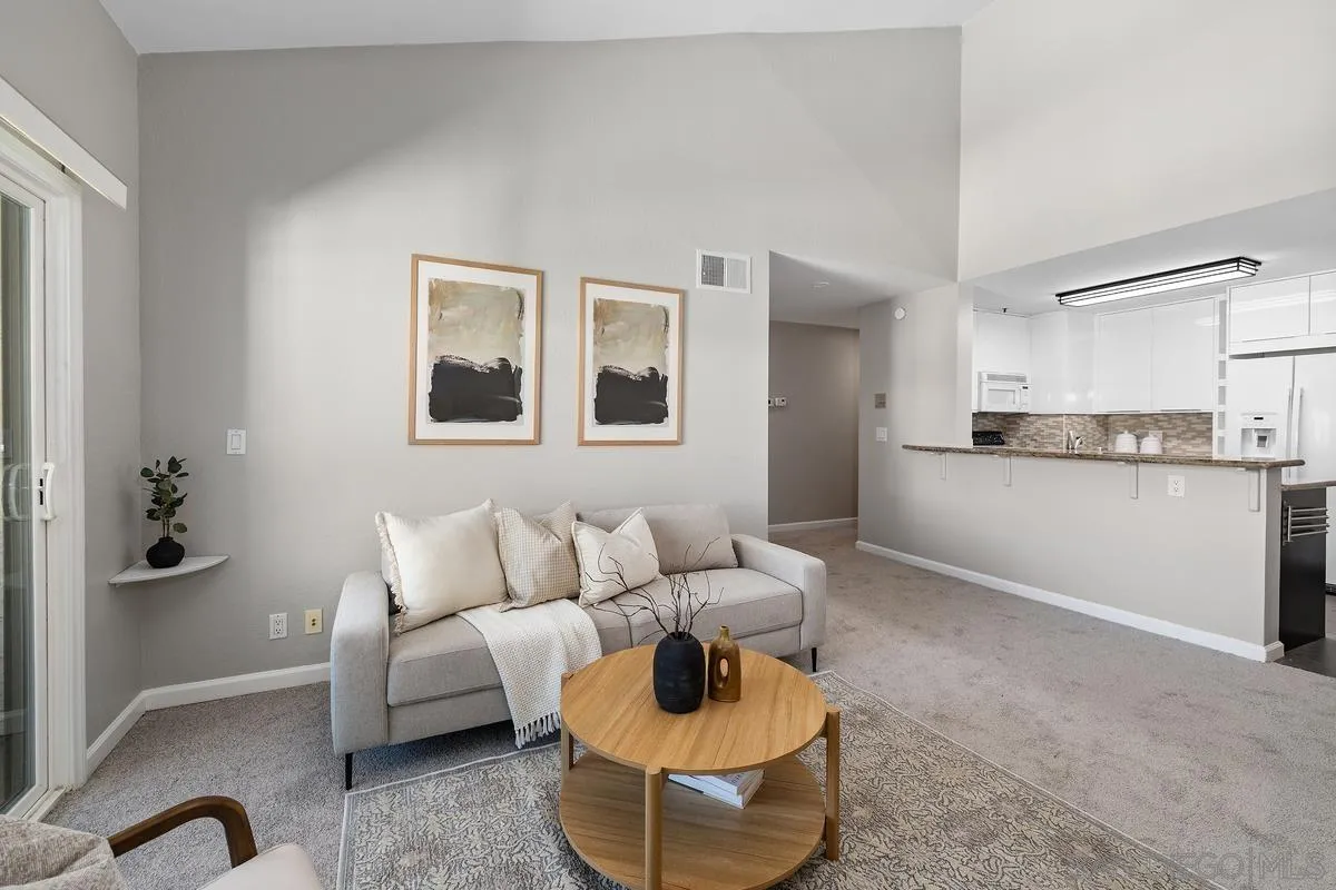 5705 Friars Road, Unit 60 San Diego, CA 92110 - Photo 4 of 49 a living room with furniture and a potted plant