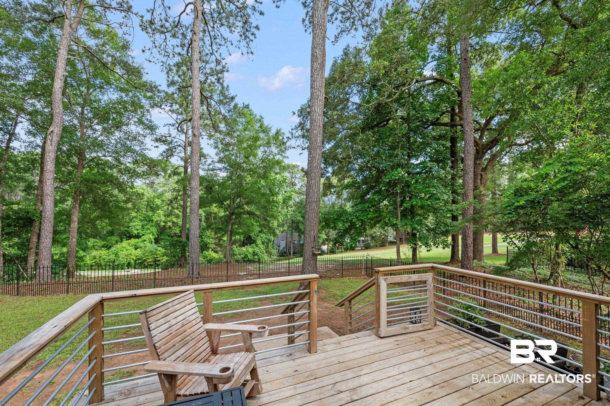 110 Ferncliff Circle Daphne, AL 36526 - Photo 34 of 40 Wooden deck with a fenced backyard and view of scattered trees