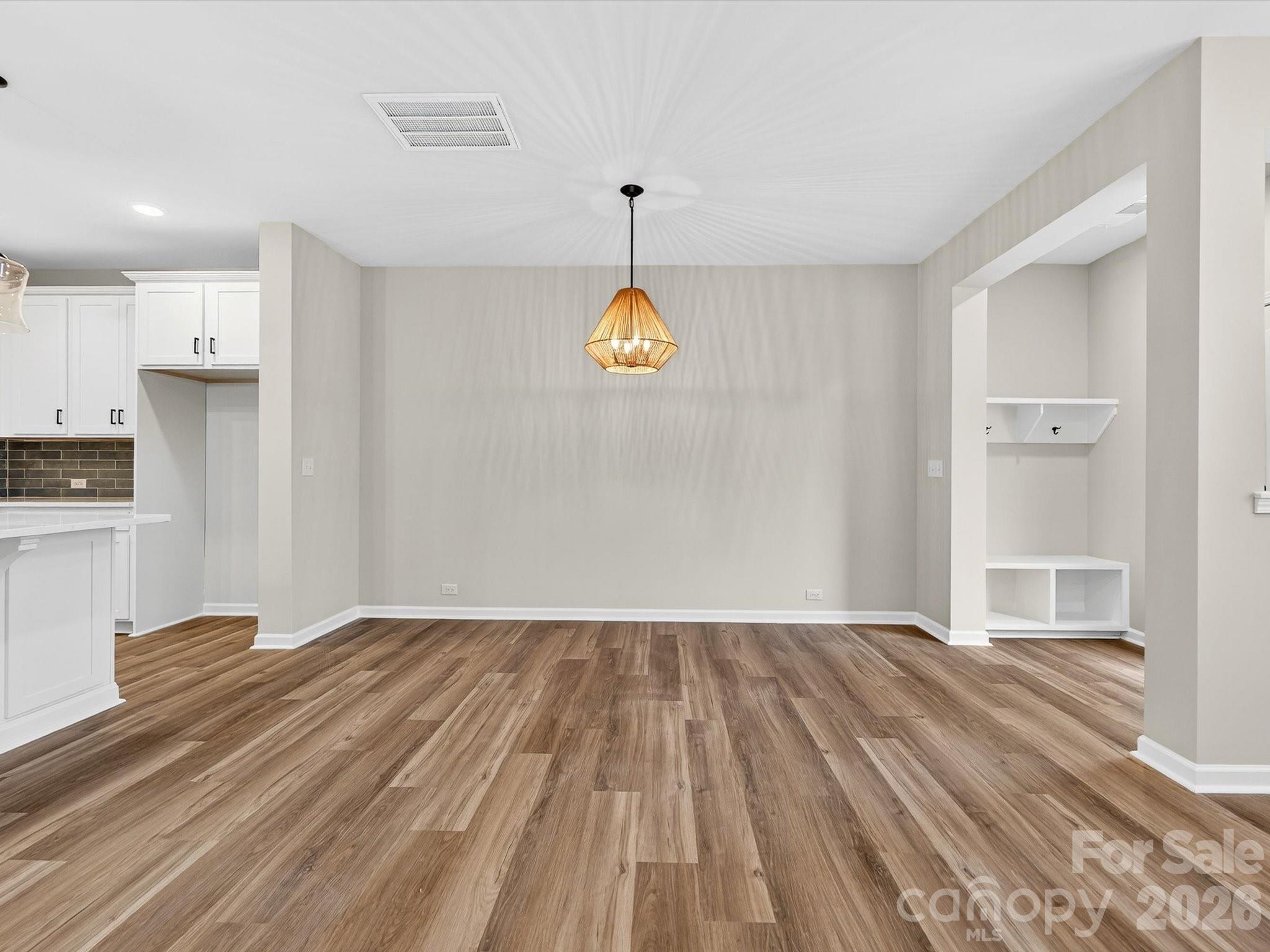 11441 Prosperity Church Road Huntersville, NC 28078 - Photo 11 of 32 a view of empty room with wooden floor and window