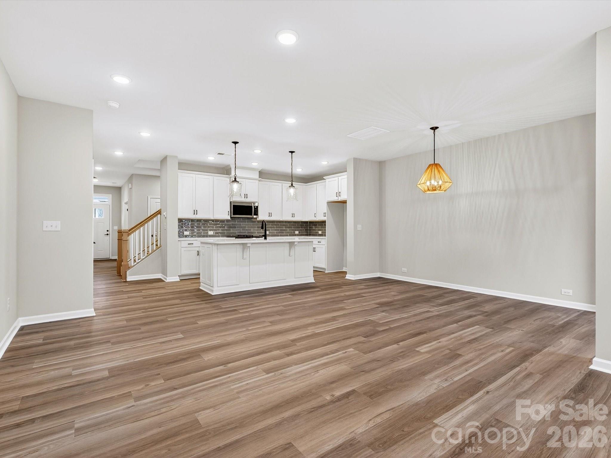 11441 Prosperity Church Road Huntersville, NC 28078 - Photo 15 of 32 a view of kitchen view wooden floor stainless steel appliances and cabinets