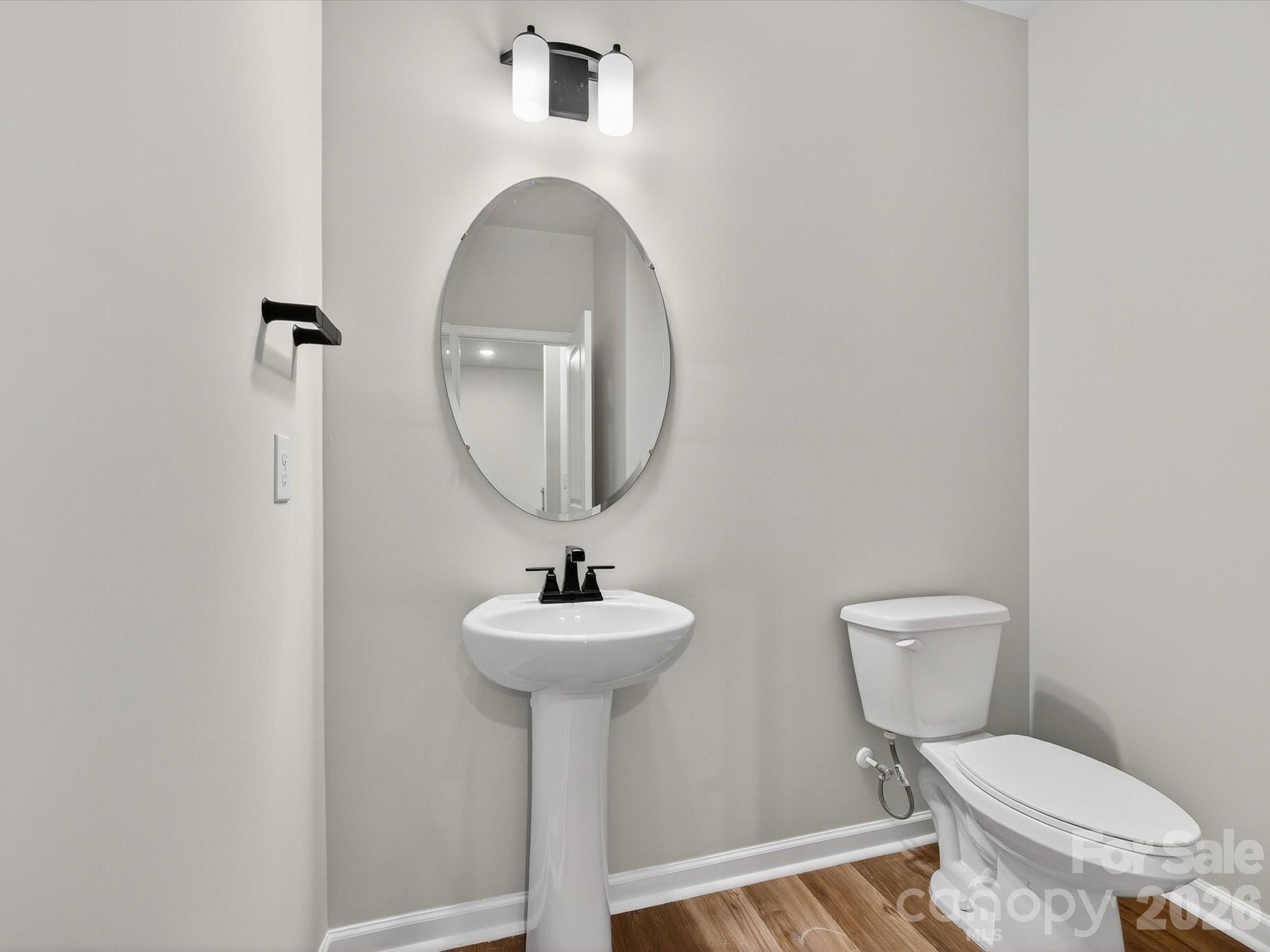 11441 Prosperity Church Road Huntersville, NC 28078 - Photo 16 of 32 a bathroom with a toilet sink and mirror