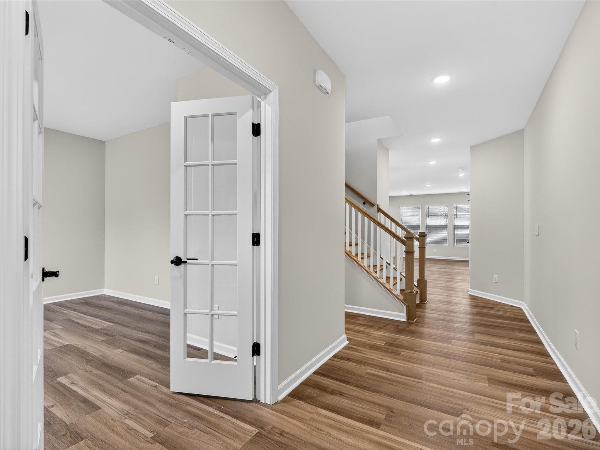 11441 Prosperity Church Road Huntersville, NC 28078 - Photo 4 of 32 a view of a hallway with wooden floor and staircase