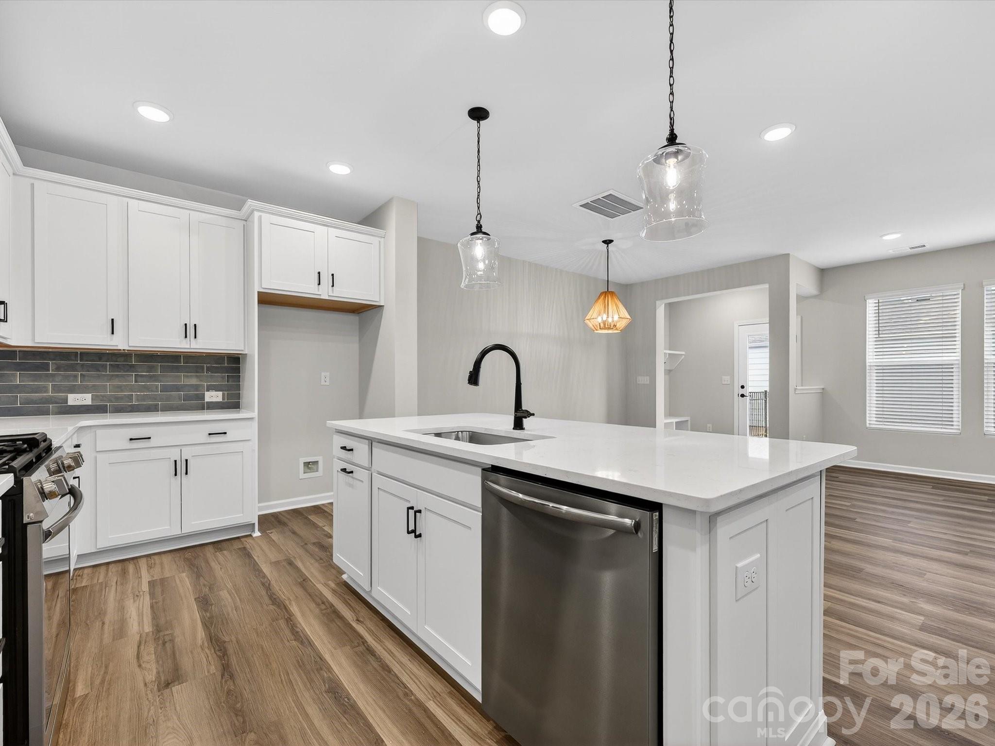 11441 Prosperity Church Road Huntersville, NC 28078 - Photo 10 of 32 a kitchen with sink stove and cabinets