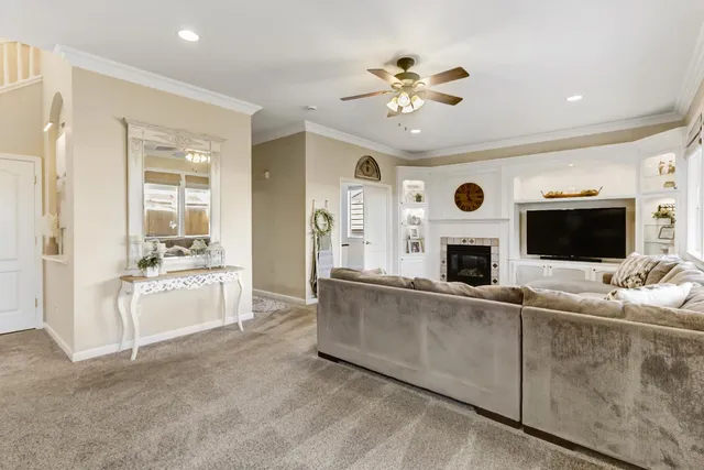 a bedroom with a bed a flat screen tv and a window