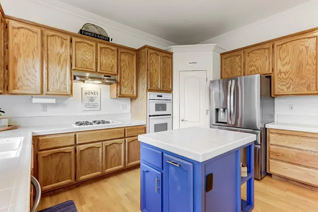 a bathroom with a sink a mirror and a shower