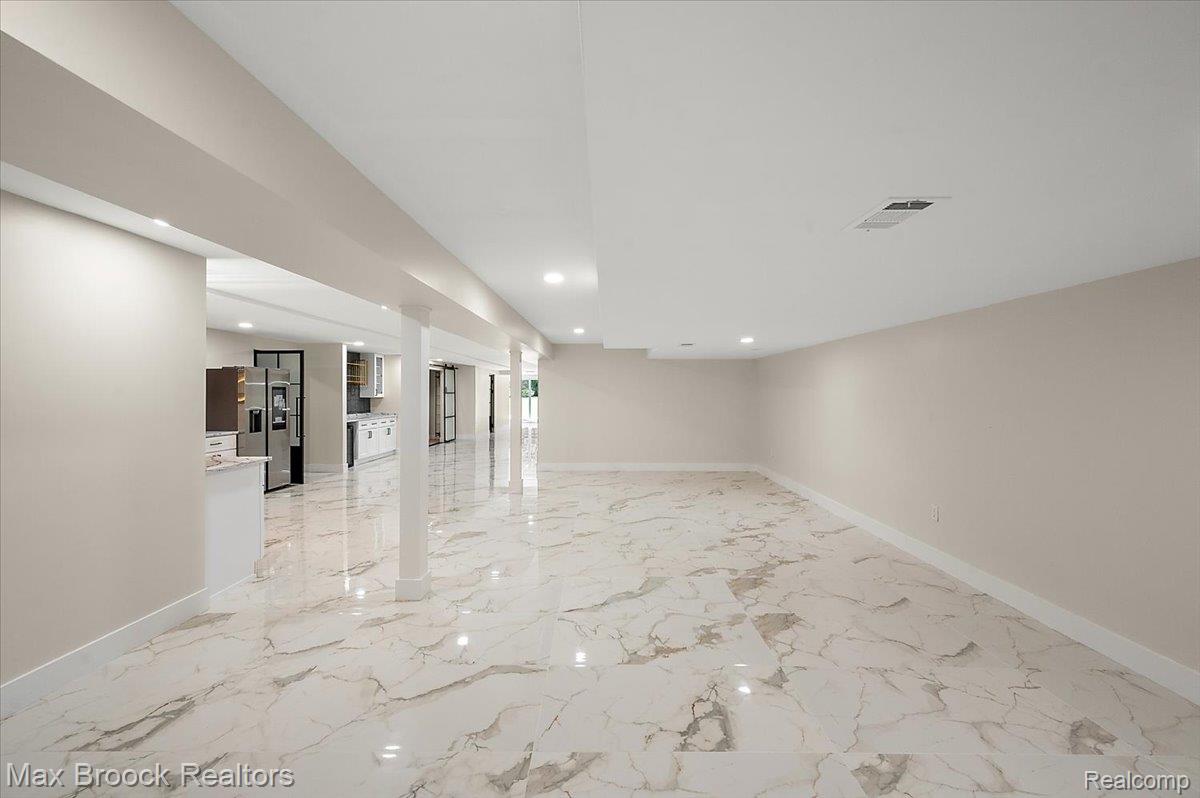 4597 Clarkston Road Clarkston, MI 48348 - Photo 54 of 74 Expansive open-concept room featuring marble-look tile flooring and recessed lighting