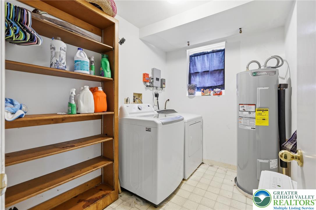 732 Bushkill Center Road Nazareth, PA 18064 - Photo 30 of 43 A dedicated laundry room with functional appliances and ample storage space.