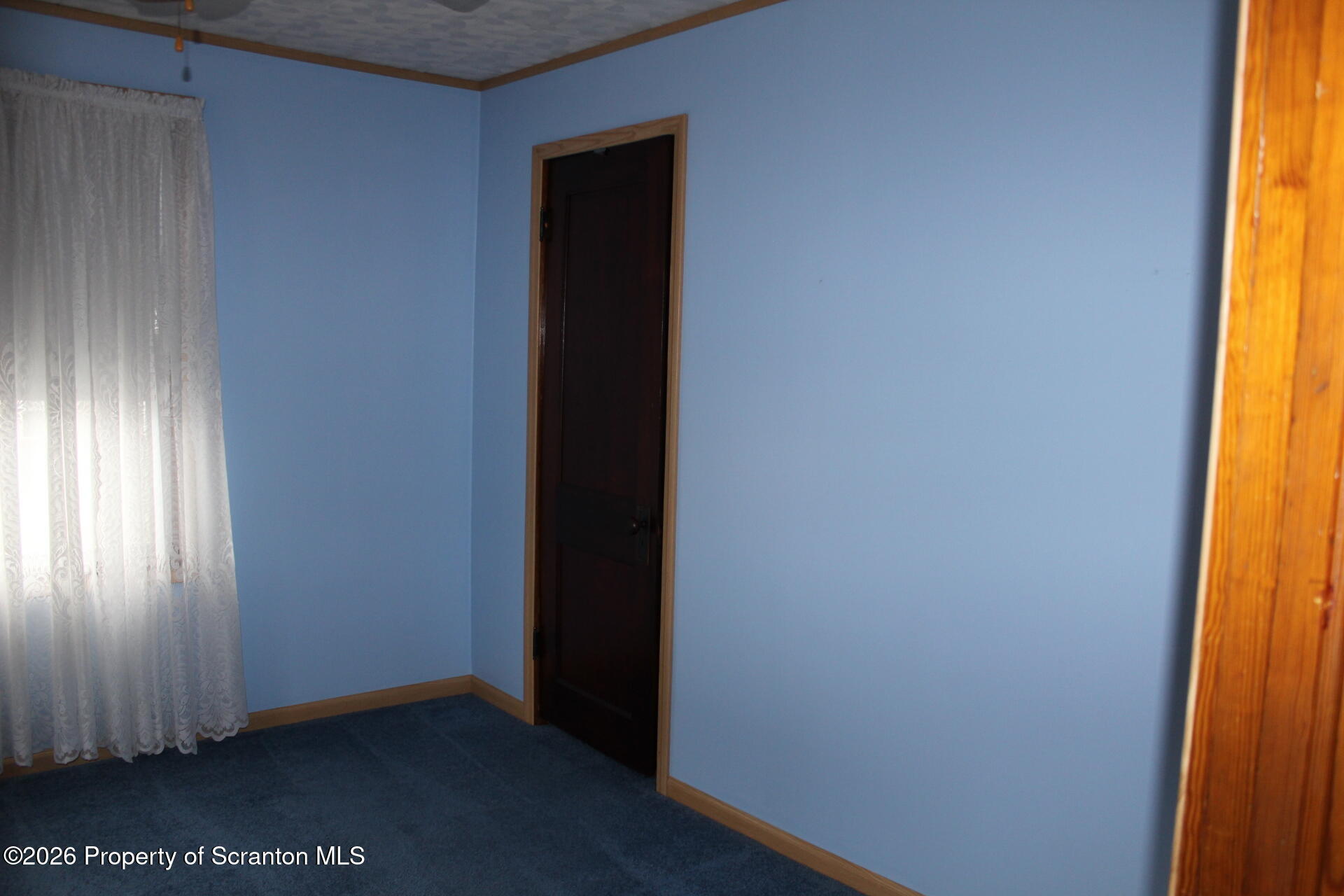 900 Wheeler Avenue Scranton, PA 18510 - Photo 12 of 25 an empty room with windows and wooden floor