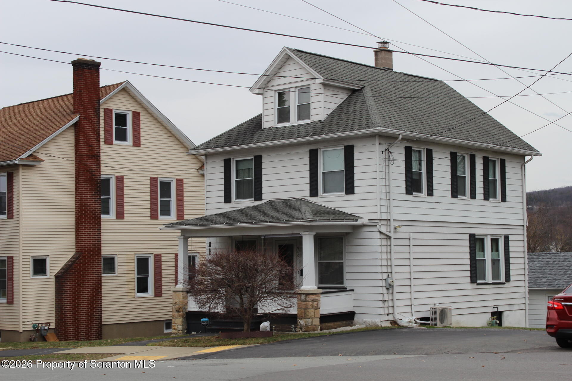 900 Wheeler Avenue Scranton, PA 18510 - Photo 4 of 25 a front view of a house with a road