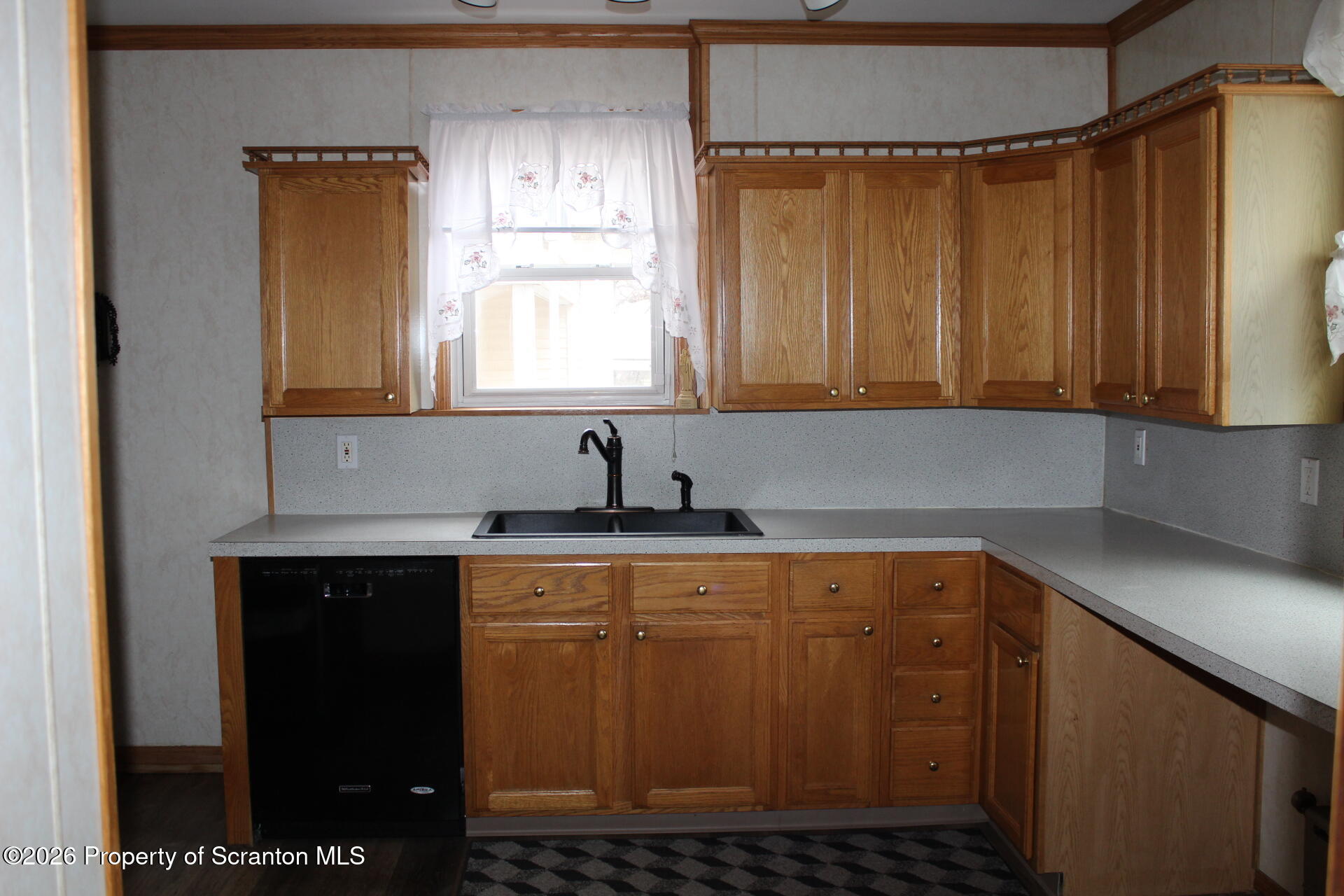 900 Wheeler Avenue Scranton, PA 18510 - Photo 9 of 25 a kitchen with a sink window and cabinets