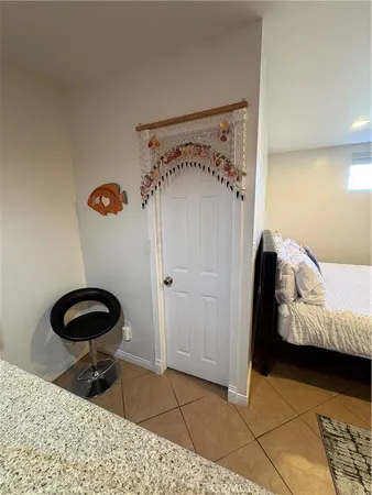 a bedroom with a bed and a chair