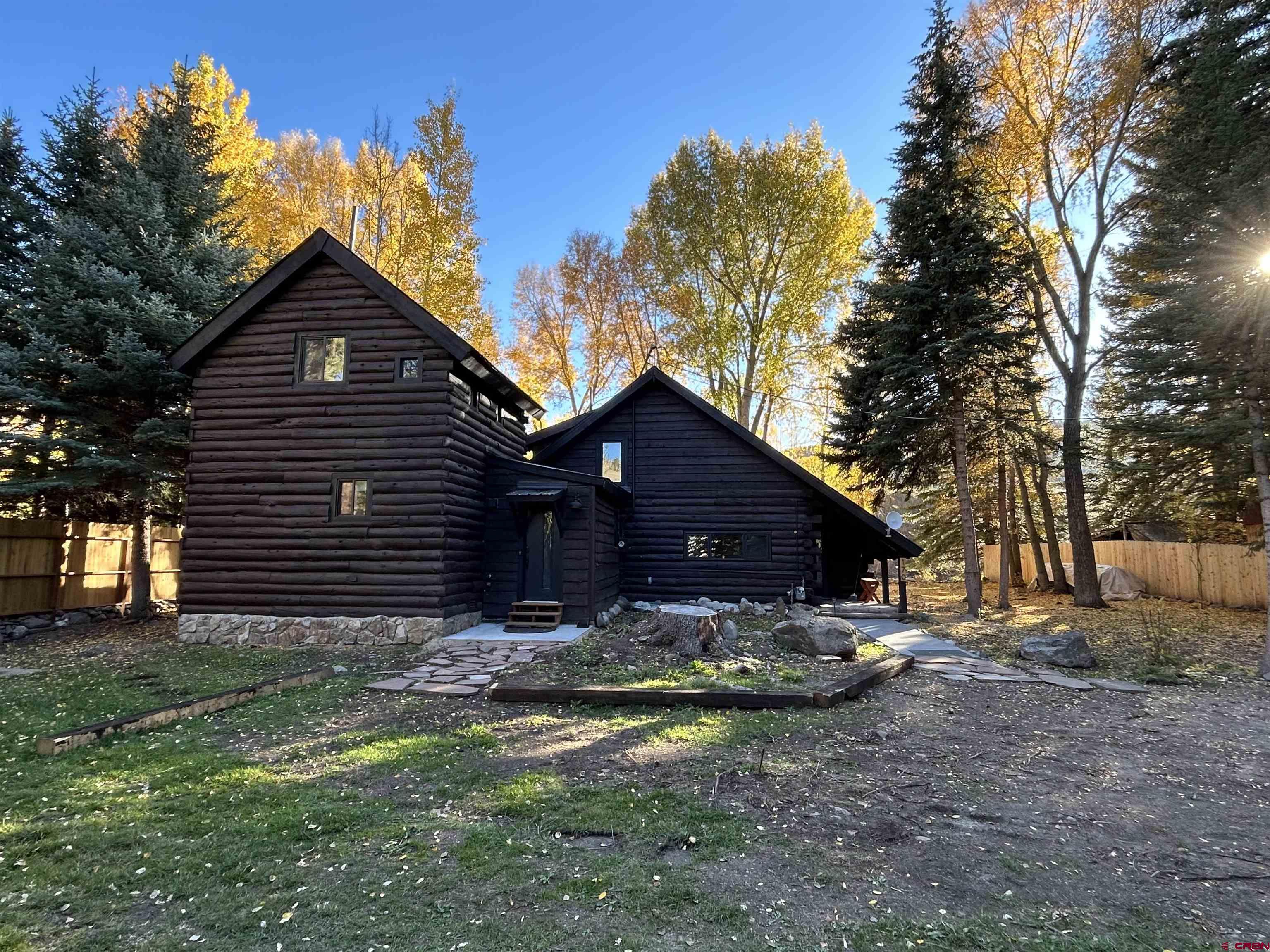 170 Lower Allen Road Crested Butte, CO 81224 - Photo 41 of 42 a view of house with yard and trees in the background