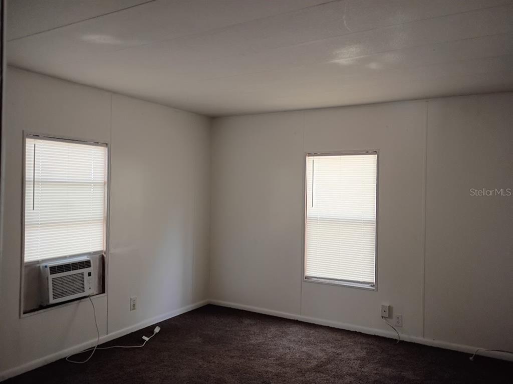 10411 Ratell Avenue Gibsonton, FL 33534 - Photo 12 of 15 wooden floor in an empty room with a window