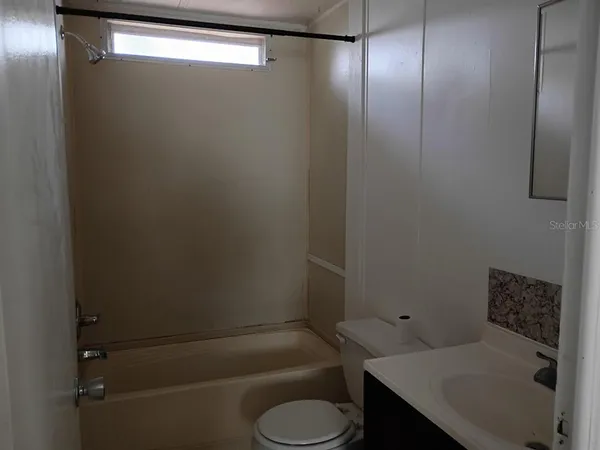 a bathroom with a sink and toilet