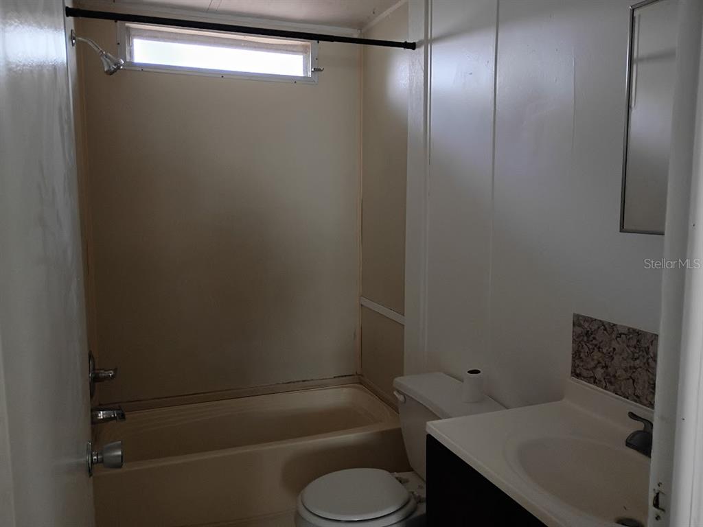 10411 Ratell Avenue Gibsonton, FL 33534 - Photo 15 of 15 a bathroom with a sink and toilet