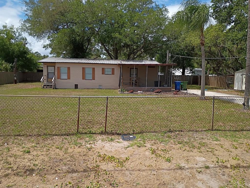 10411 Ratell Avenue Gibsonton, FL 33534 - Photo 2 of 15 a view of a house with a backyard