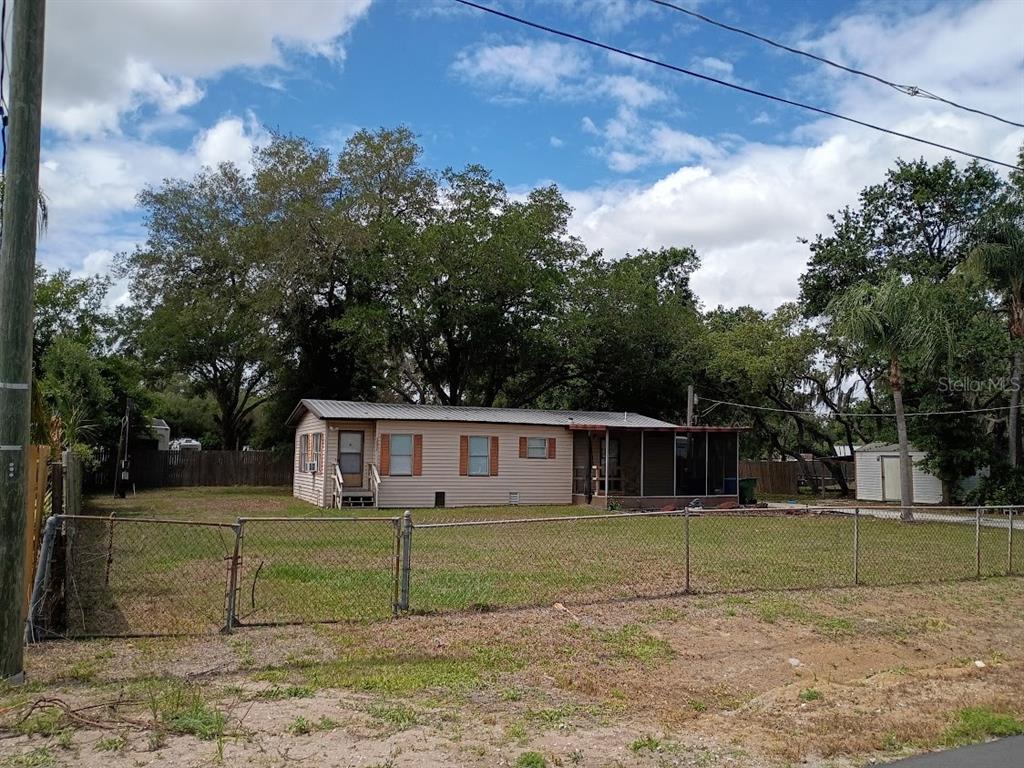 10411 Ratell Avenue Gibsonton, FL 33534 - Photo 3 of 15 a view of a house with a backyard