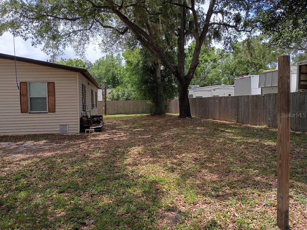 10411 Ratell Avenue Gibsonton, FL 33534 - Photo 5 of 15 a view of a backyard