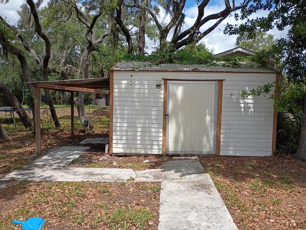 10411 Ratell Avenue Gibsonton, FL 33534 - Photo 6 of 15 a view of a house with a yard