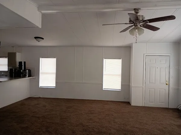 a view of an empty room and window