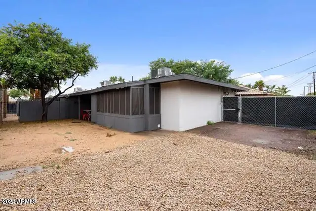 a house with trees in the background
