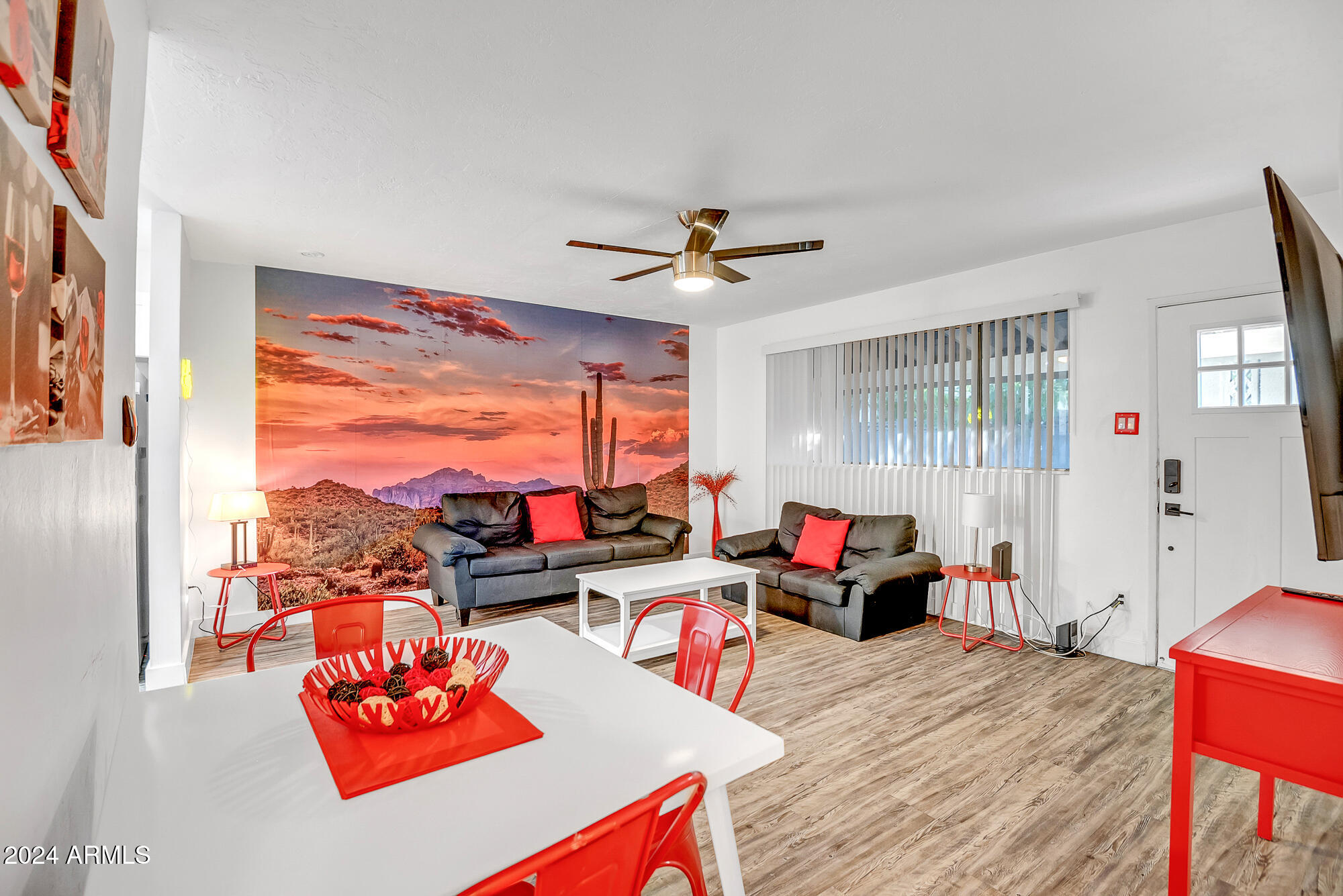 7832 East Heatherbrae Avenue, Unit C Scottsdale, AZ 85251 - Photo 20 of 48 a living room with furniture and a flat screen tv