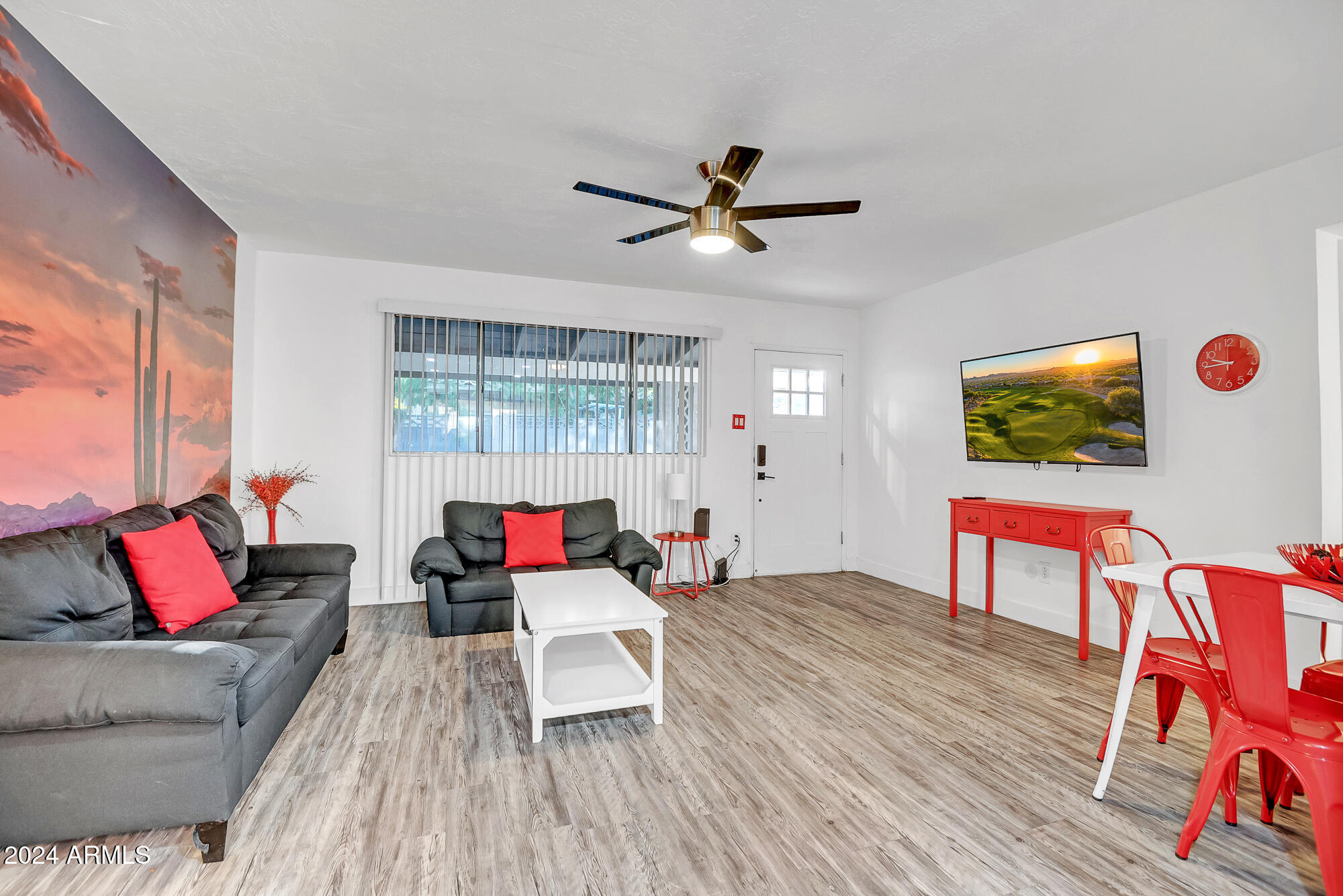 7832 East Heatherbrae Avenue, Unit C Scottsdale, AZ 85251 - Photo 2 of 48 a living room with furniture and a wooden floor