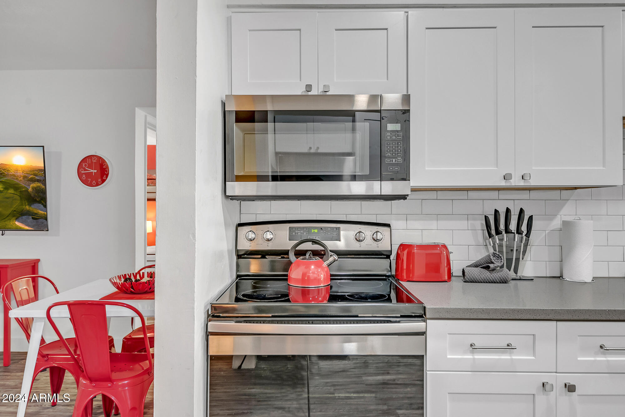 7832 East Heatherbrae Avenue, Unit C Scottsdale, AZ 85251 - Photo 22 of 48 a stove top oven sitting inside of a kitchen