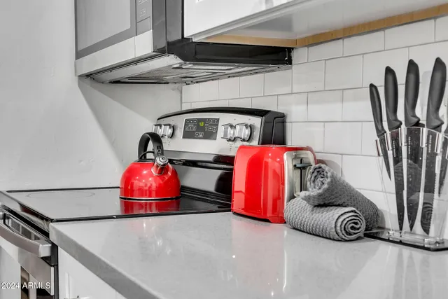 a view of front door with washer and dryer