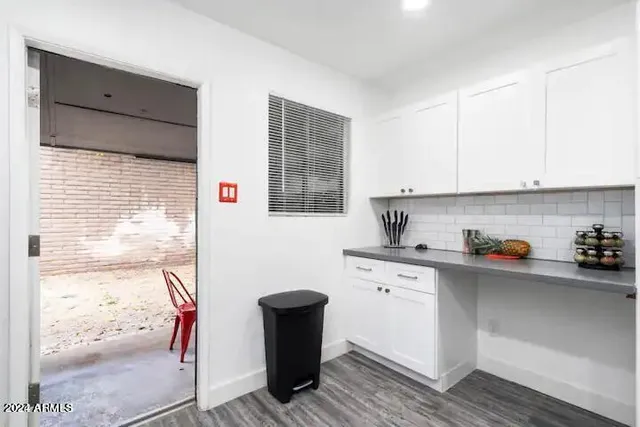 a kitchen with stainless steel appliances a sink and cabinets
