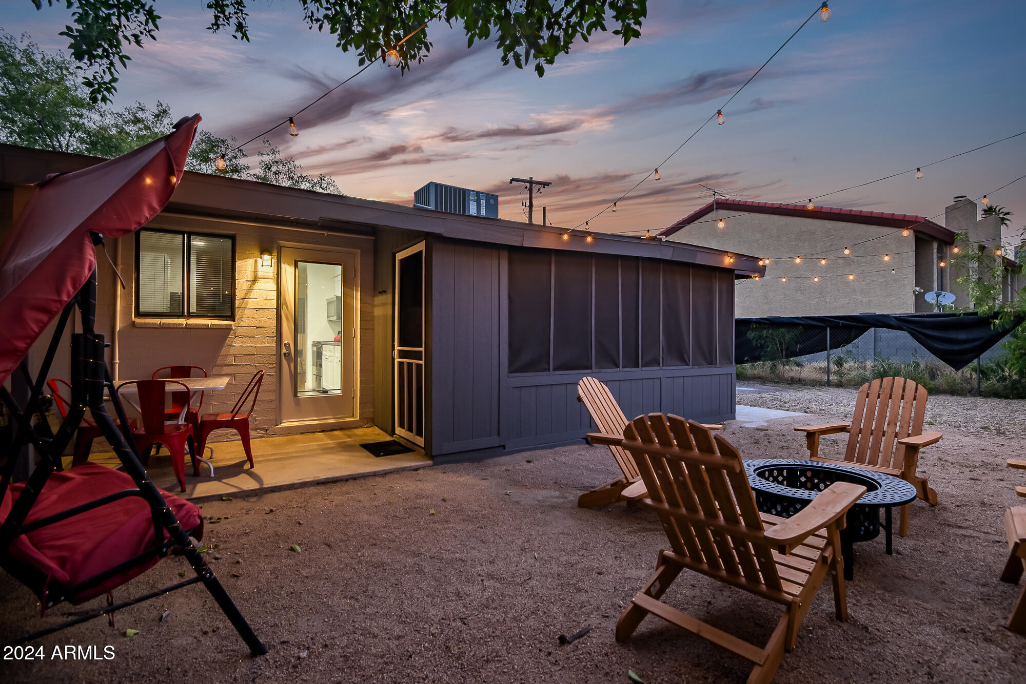 7832 East Heatherbrae Avenue, Unit C Scottsdale, AZ 85251 - Photo 31 of 48 a backyard of a house with table and chairs