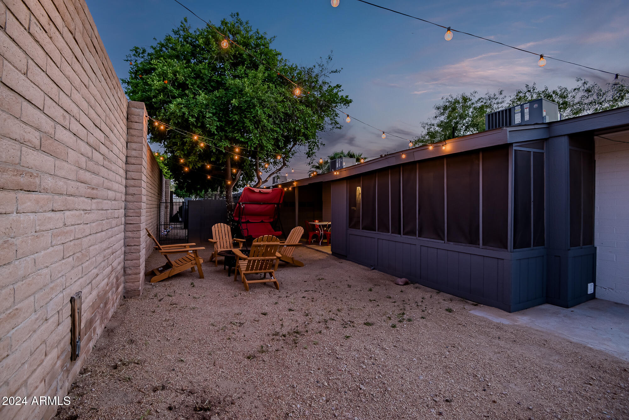 7832 East Heatherbrae Avenue, Unit C Scottsdale, AZ 85251 - Photo 34 of 48 a view of backyard with outdoor seating and wooden fence
