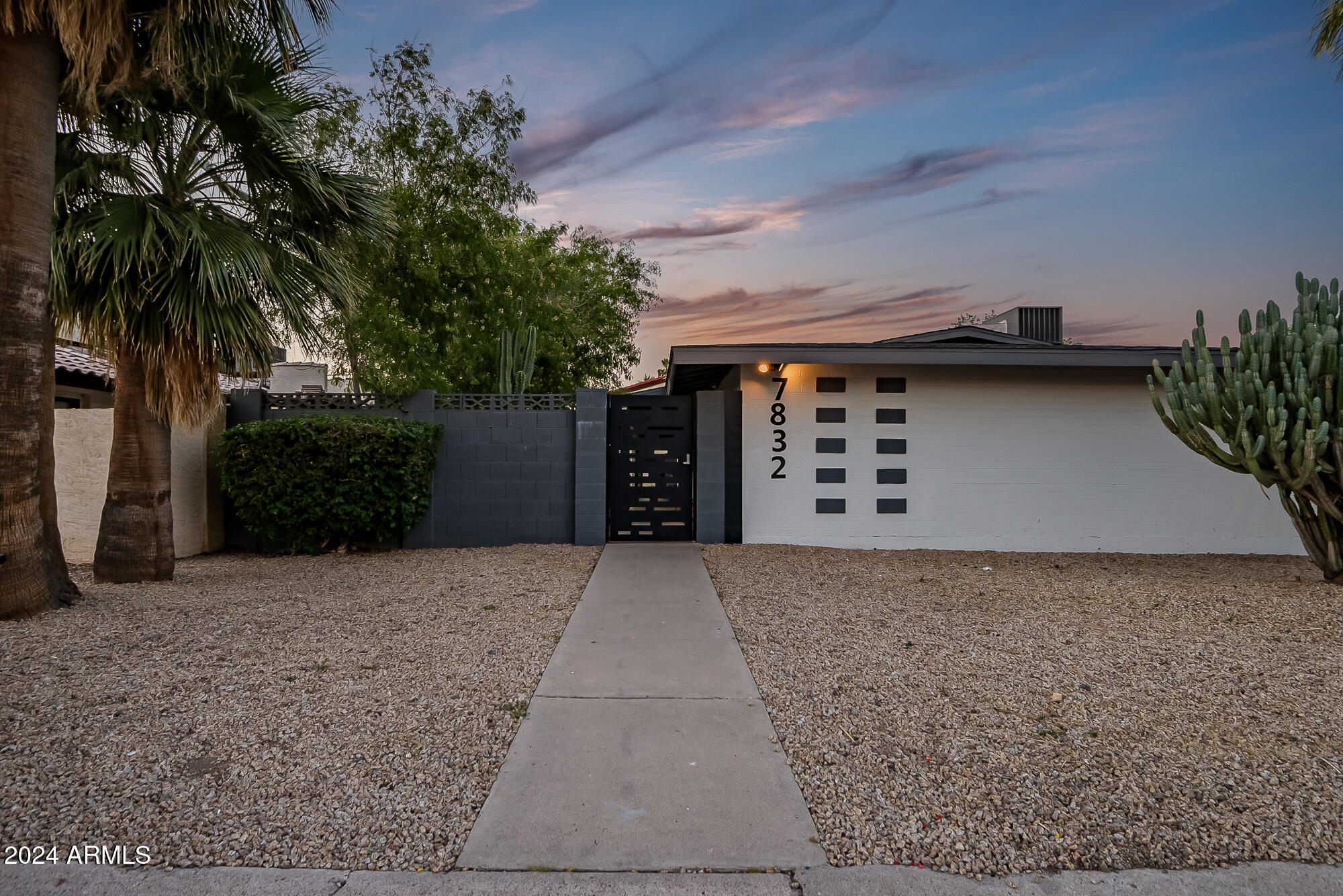 7832 East Heatherbrae Avenue, Unit C Scottsdale, AZ 85251 - Photo 44 of 48 front view of a house with a yard