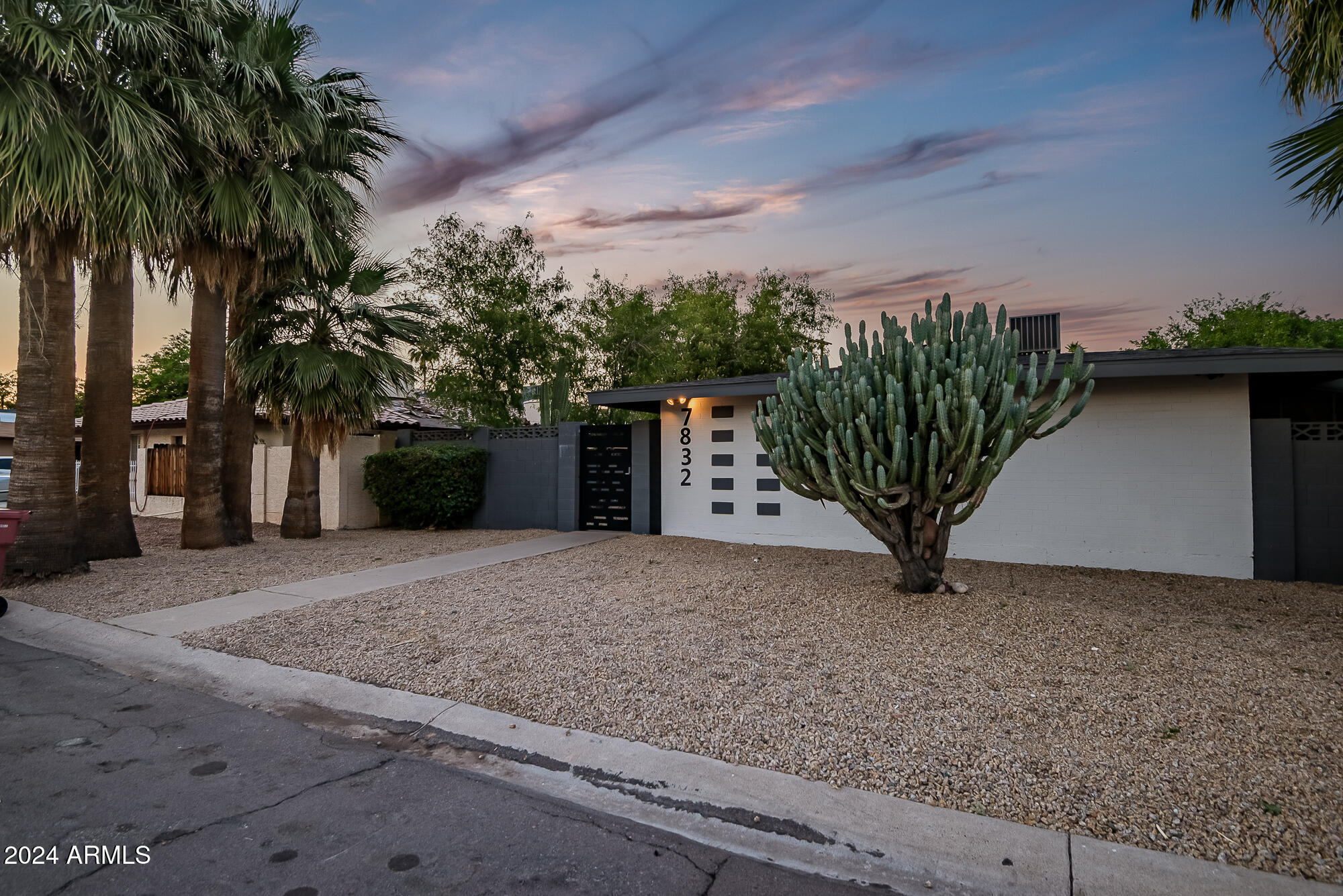 7832 East Heatherbrae Avenue, Unit C Scottsdale, AZ 85251 - Photo 45 of 48 a view of a yard with potted plants