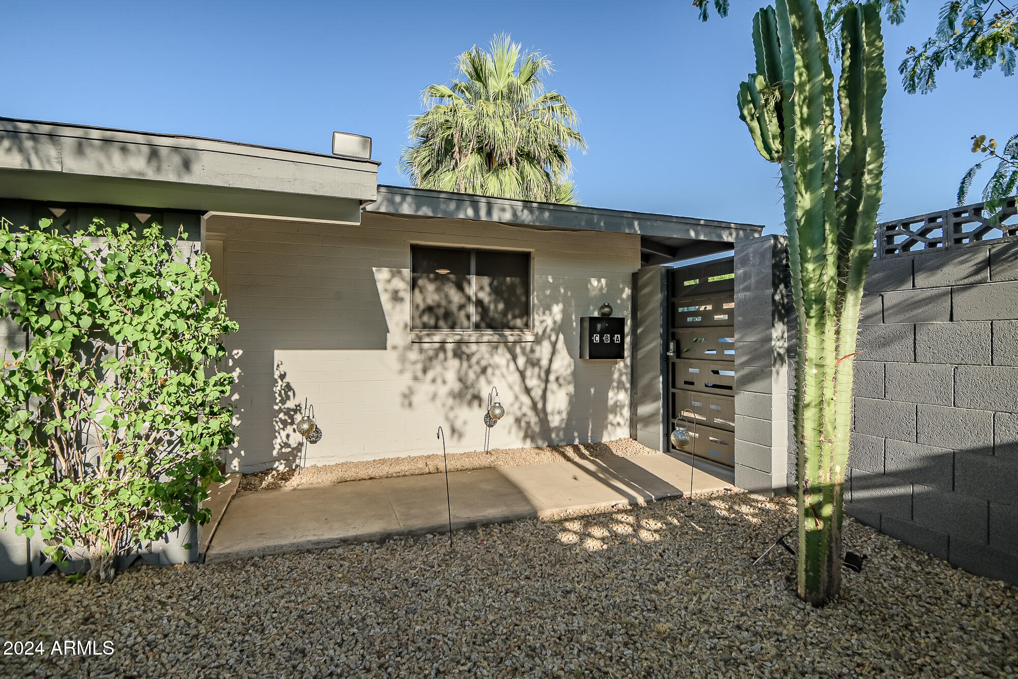 7832 East Heatherbrae Avenue, Unit C Scottsdale, AZ 85251 - Photo 48 of 48 a front view of a house with a yard
