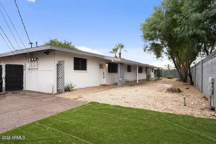 7832 East Heatherbrae Avenue, Unit C Scottsdale, AZ 85251 - Photo 10 of 48 a front view of a house with a garden